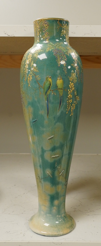 A Doulton Titanian ‘parakeet’ vase with raised floral and leaf design, 37cm high. Condition - considerable stapled restoration